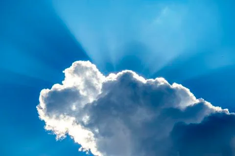 .incredibly dramatic clouds with the bright rays of the sun that breaks throu Stock Photos