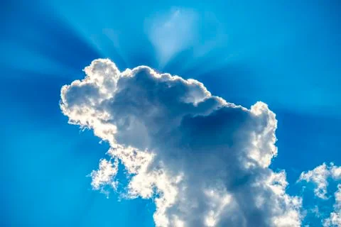 .incredibly dramatic clouds with the bright rays of the sun that breaks throu Stock Photos