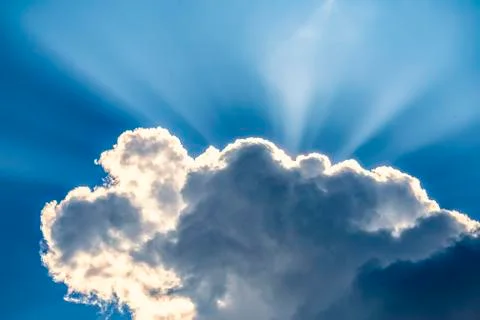 .incredibly dramatic clouds with the bright rays of the sun that breaks throu Stock Photos
