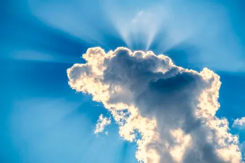 .incredibly dramatic clouds with the bright rays of the sun that breaks throu Stock Photos