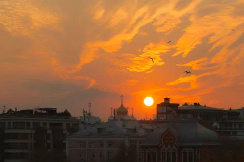 Incredibly expressive cloudscape in sunset light in red, orange and yellow Stock Photos
