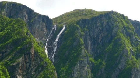 Incredibly long waterfall in western brook pond in Gros Morne Stock Footage