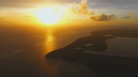 Incredibly view from the air of the sunset and the island in the ocean Stock Footage 72152305