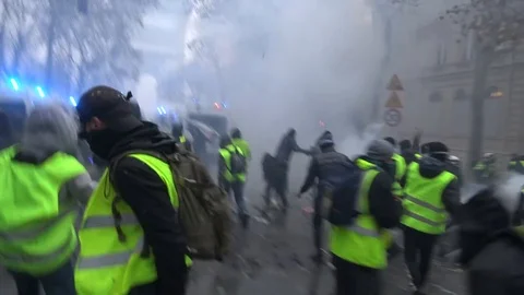 Incredibly violent mob of yellow vests rioters attacking police vehicles Video stock 103182735