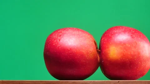 Indecent apples motion on table chroma key dolly shot Stock Footage 64258288