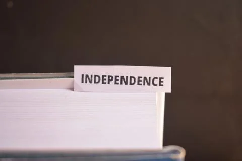 Independence Bookmark Inserted in Book Representing Freedom, Self-Reliance .. Fotos Stock