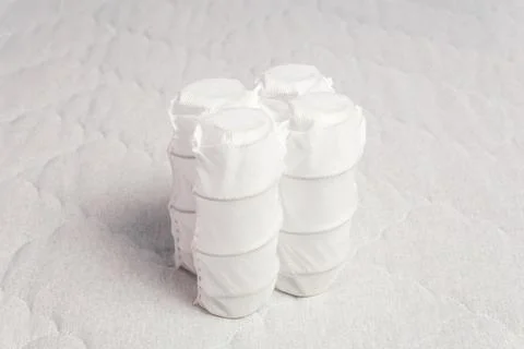 Independent spring block packed in white spunbond. Fotos Stock