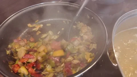 An InDepth Look at the Vegetable StirFry Cooking Process in the Kitchen for Stock Footage 310611370