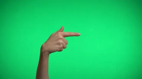 The index finger indicates the direction on a green background. Video stock 163600123