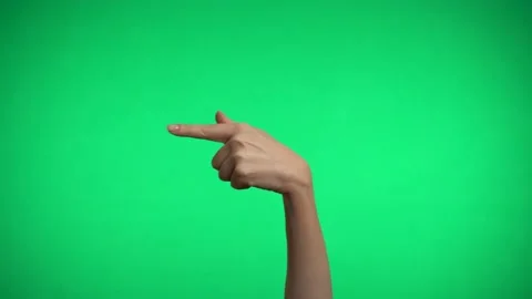 The index finger indicates the direction on a green background. Video stock 163600258