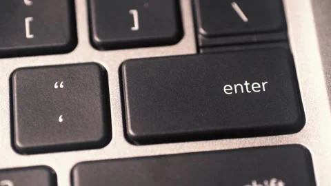 The index finger presses the ENTER key on the laptop keyboard. Stock Footage 327247581