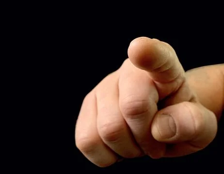 The index finger pushes the button from the inside. Finger touch to switch in Stock Photos
