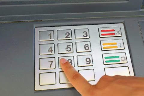 Index finger while typing the keys the pin code to access the electronic syst Stock Photos