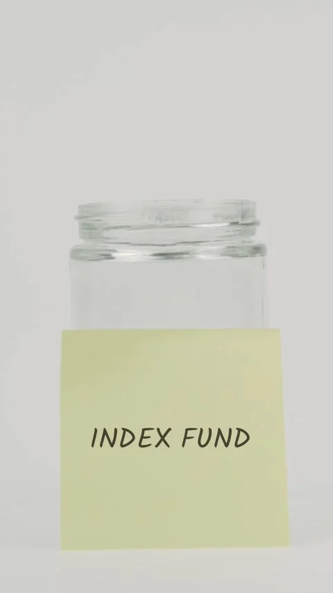 Index fund text or word on yellow sticky note attached to glass jar Stock Footage 311743286