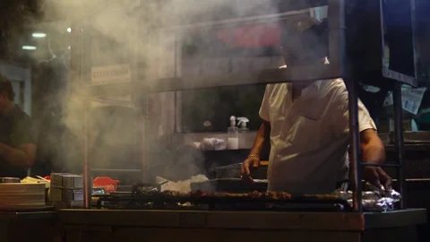 India- 2024, Jul 8: Chef Preparing Takeaway by wrapping in foil at Food Stall Stock-Footage 279210366