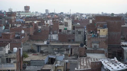 India Bare Bones Brick Buildings Cityscape View of Slum in Amritsar Stock Footage 129586779