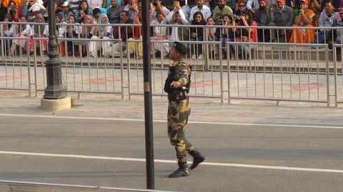 India Border Security Hypeman at Wagah Pakistan-India Border Flag Lowering Stock Footage 129586391