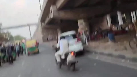 India: Cab driver drags traffic inspector after document dispute in northern... Stock Footage 280529141