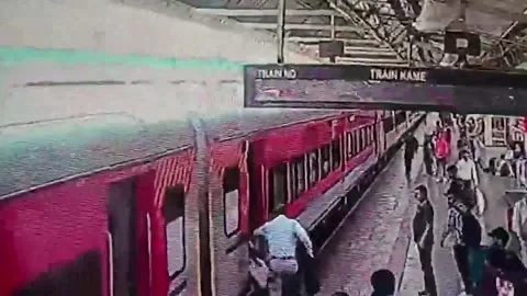 India: Courage under pressure shines as alert on-duty official rescues 61... Stock Footage 332753434