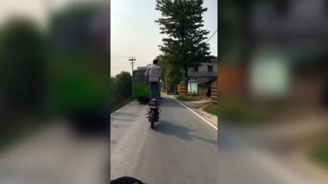 India: Daredevil biker performs stunts without helmet, raises safety concern... Stock Footage 276485275