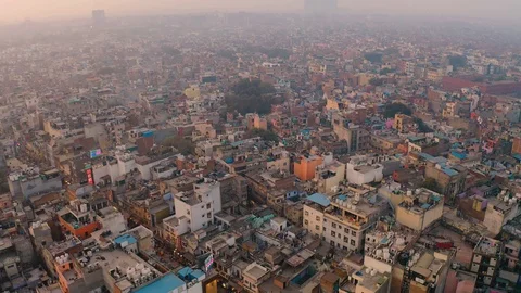 India, Delhi city center slums roofs aerial 4k drone scenes, evening skyline Stock Footage