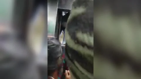 India: Dramatic footage shows people stuck in elevator being rescued to s... Stock Footage 294057205