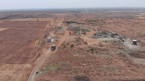 India, A drone camera aerial view of a truck moving towards a granite quarry Video stock 109246176