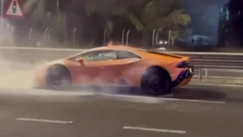 India: Fire erupts in moving Lamborghini on Mumbai's road, no injuries re... Stock Footage 296348257