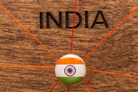 India flag on the pin with red thread showed the paths on the wooden map. Stock Photos