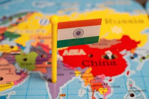 India flag pin on world map showing Asia continent Stock Photos