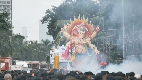 India, A giant Ganapathi  idol  driven in the street for  immersion. Stock Footage 123336855