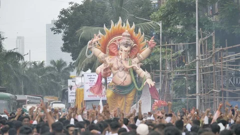 India, A giant Ganapathi  idol  driven in the street for  immersion. Stock Footage 123337504