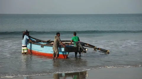 INDIA, GOA - 2012: Indian men and a boat for fishing Stock Footage 45428580