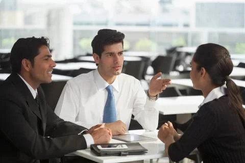 India, Group discussion with two men and one woman Stock Photos
