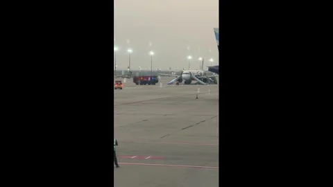India: IndiGo Flight Evacuated at Bengaluru Airport After Smoke Fills Cab... Stock Footage 335848014