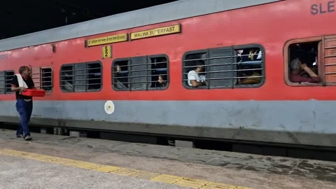 India- July 25, 2024: The train has started moving slowly from the platform. Stock Footage 283280799