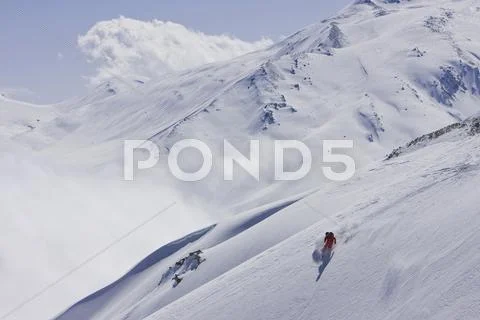 India, Kashmir, Gulmarg, Man Skiing Downhill