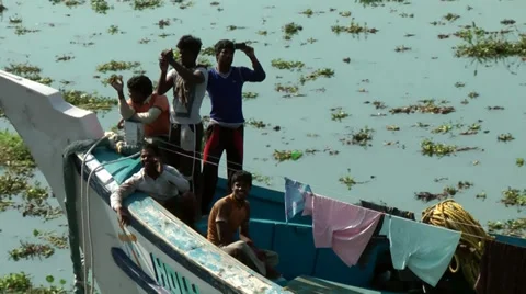 India Kerala Kochi Cochin City 006 indigenous people on a boat's deck Stock Footage