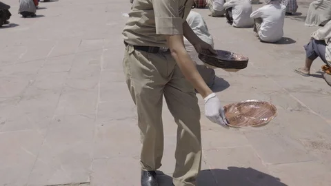 India Lockdown, Hungry poor people, police distributing food, Rishikesh Stock Footage 129070163