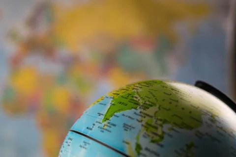 India map on a globe with earth map in the background. Stock Photos
