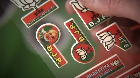 India, Narendra Modi gadgets inside BJP party propaganda shop headquarters Stock Footage 77084868
