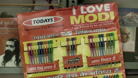 India, Narendra Modi gadgets inside BJP party propaganda shop headquarters Stock Footage 77085870