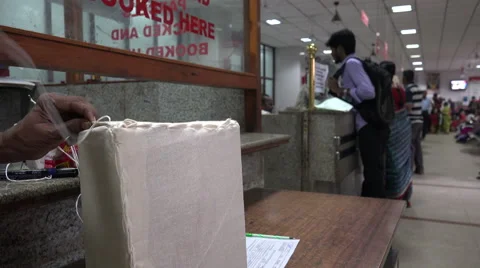 India post office, wrapping a package with cloth and thread Stock Footage 48772705