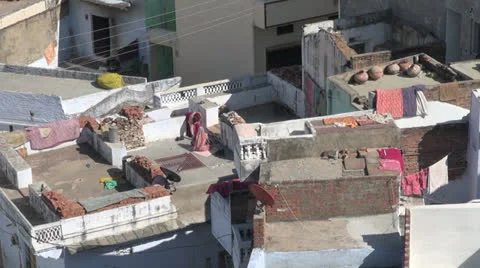India Rajasthan Deogarh rooftop divided space and women Stock Footage 24461961