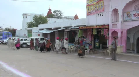 India Rajasthan Pushkar pilgrims approach entrance pan 3 Stock Footage 24631165