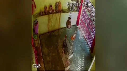 India: Robber commits daylight theft in northern India, steals copper urn fr... Stock Footage 284932864