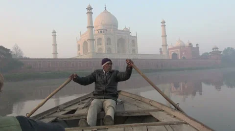 India rowing past the Taj at dawn Stock Footage 24651460