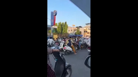 India: Surat Sees Massive Queues at Petrol Pumps as War Rumours Trigger P... Stock Footage 331415500