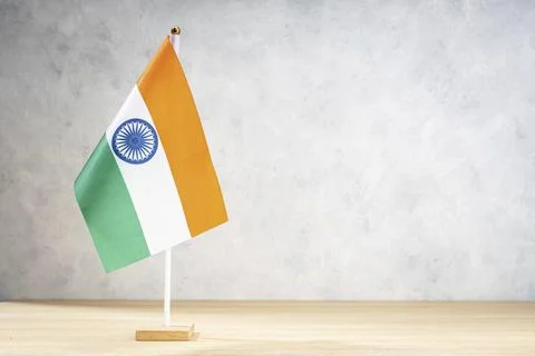 India table flag on white textured wall. Copy space for text, designs or Stock Illustration
