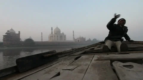 India Taj at dawn with boatman Stock Footage 24651900